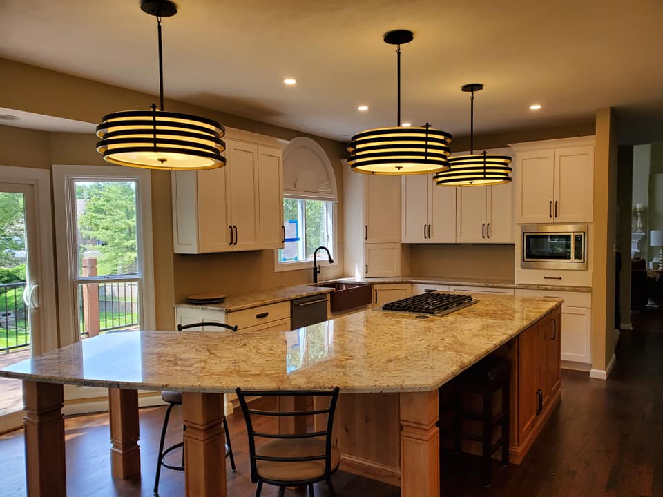 kitchen pic bro an image of a modular kitchen with lights and chairs