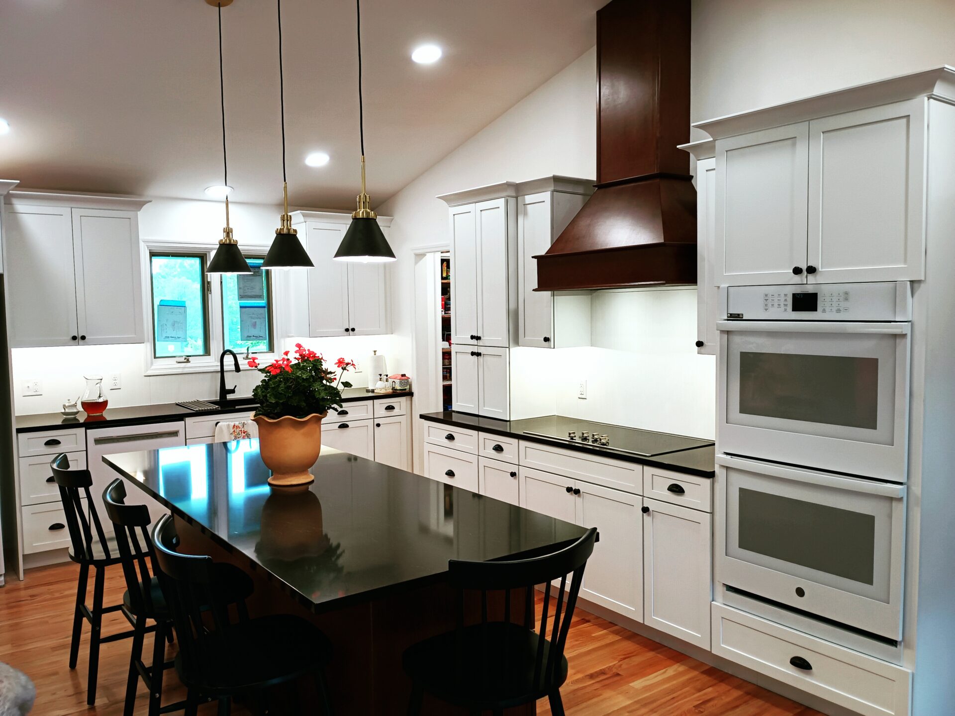IMG_20240515_135603 an image of a modular kitchen with lights and chairs